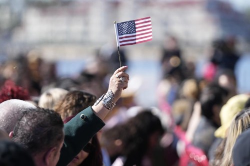 FILE - People recite an oath during a naturalization ceremony Wednesday, Feb. 15, 2023, in San Diego. Population estimates released Thursday, June 22, 2023, by the U.S. Census Bureau show what drove changes in different race and ethnic groups last year, as well as since the start of COVID-19's spread in the U.S. in April 2020. The United States had grown to 333.2 million people by the middle of last year, a 0.4% increase over the previous year, according to the 2022 population estimates. (AP Photo/Gregory Bull, File)