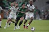 Austin FC forward Sebastian Driussi, center, works the ball past FC Dallas defender Nkosi Tafari, right, during the second half of an MLS soccer match in Austin, Texas, Wednesday, June 21, 2023. (AP Photo/Eric Gay)