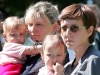 FILE - Yelena, right, wife of Vyacheslav Milashevsky, commander of the Russian AS-28 mini-submarine, and unidentified relative hold children as they wait outside a hospital in Russia's far eastern city of Petropavlovsk-Kamchatsky, Monday, Aug. 8, 2005. Rescuers cut the Russian mini-submarine free of tangled deep-sea cables, saving its seven crew with British help, after a three-day ordeal deep in the Pacific with dwindling oxygen. (AP Photo/Viktor Korotayev, Pool)