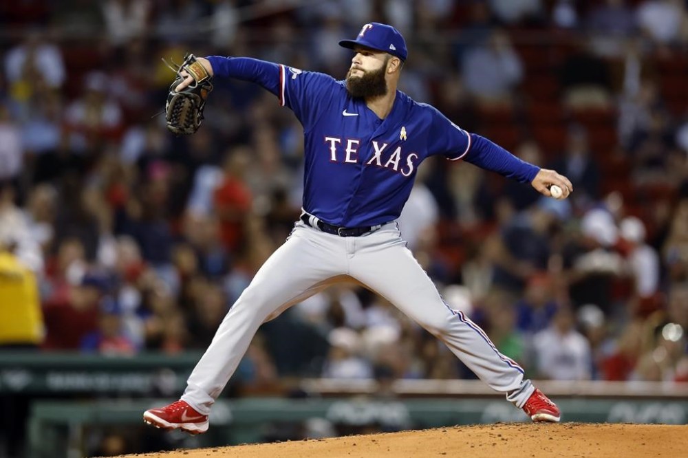 FILE - Texas Rangers' Dallas Keuchel pitches during the first inning of a baseball game against the Boston Red Sox, Friday, Sept. 2, 2022, in Boston. Former American League Cy Young Award winner Dallas Keuchel has agreed to a minor league contract with the Minnesota Twins. “We’re glad to have him in the organization and to give him an opportunity to go out there and pitch and show all the things that he’s been working on, because I’ve heard he’s been working on a few things,” Twins manager Rocco Baldelli said before Thursday's, June 22, 2023, game against Boston.(AP Photo/Michael Dwyer, File)