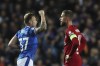 Rangers' Scott Arfield, left, celebrates after scoring the opening goal as Liverpool's Jordan Henderson stands on the pitch during the Champions League Group A soccer match between Rangers and Liverpool at Ibrox stadium in Glasgow, Scotland, Wednesday, Oct. 12, 2022. THE CANADIAN PRESS/AP-Scott Heppell