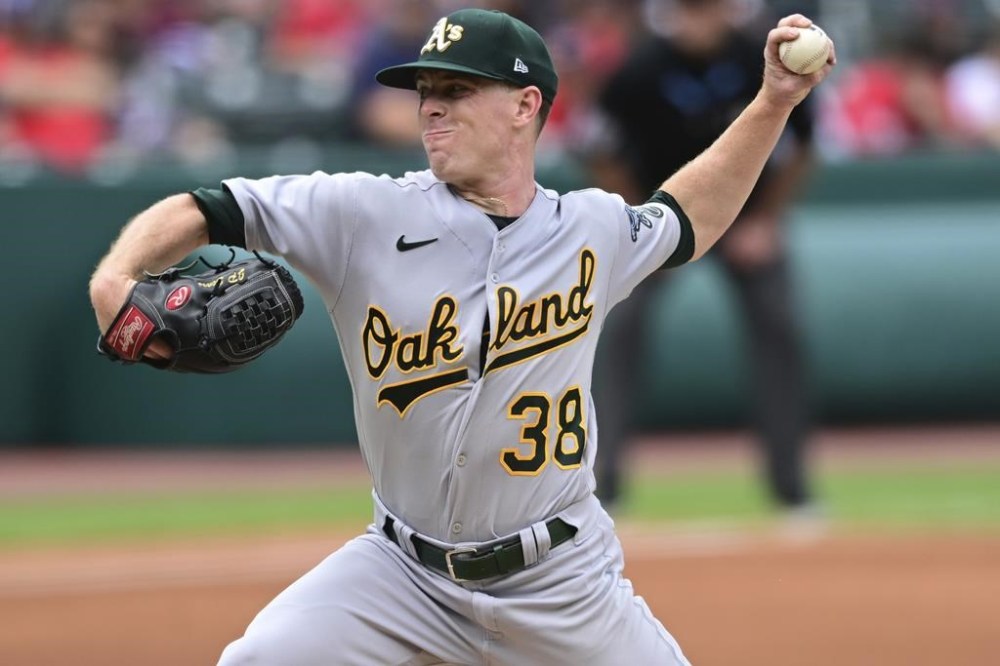 Oakland Athletics starting pitcher JP Sears delivers during the first inning of a baseball game against the Cleveland Guardians, Thursday, June 22, 2023, in Cleveland. (AP Photo/David Dermer)