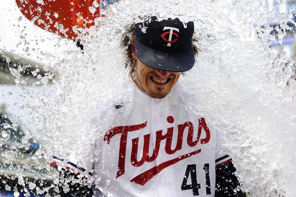 Minnesota Twins starting pitcher Joe Ryan (41) is doused with water after pitching a complete-game shutout to defeat the Boston Red Sox 6-0 in a baseball game Thursday, June 22, 2023, in Minneapolis. (AP Photo/Abbie Parr)