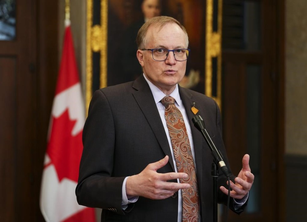 NDP member of Parliament Peter Julian speaks to reporters in the foyer of the House of Commons on Parliament Hill in Ottawa on Thursday, June 15, 2023. Julian says Canadians can be confident that a public inquiry on foreign interference is going to happen. THE CANADIAN PRESS/Sean Kilpatrick