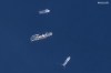 In this satellite image provided by Maxar Technologies, from top to bottom, the vessels Horizon Arctic, Deep Energy and Skandi Vinland search for the missing submersible Titan, Thursday, June 22, 2023 in the Atlantic Ocean. (Satellite image ©2023 Maxar Technologies via AP)