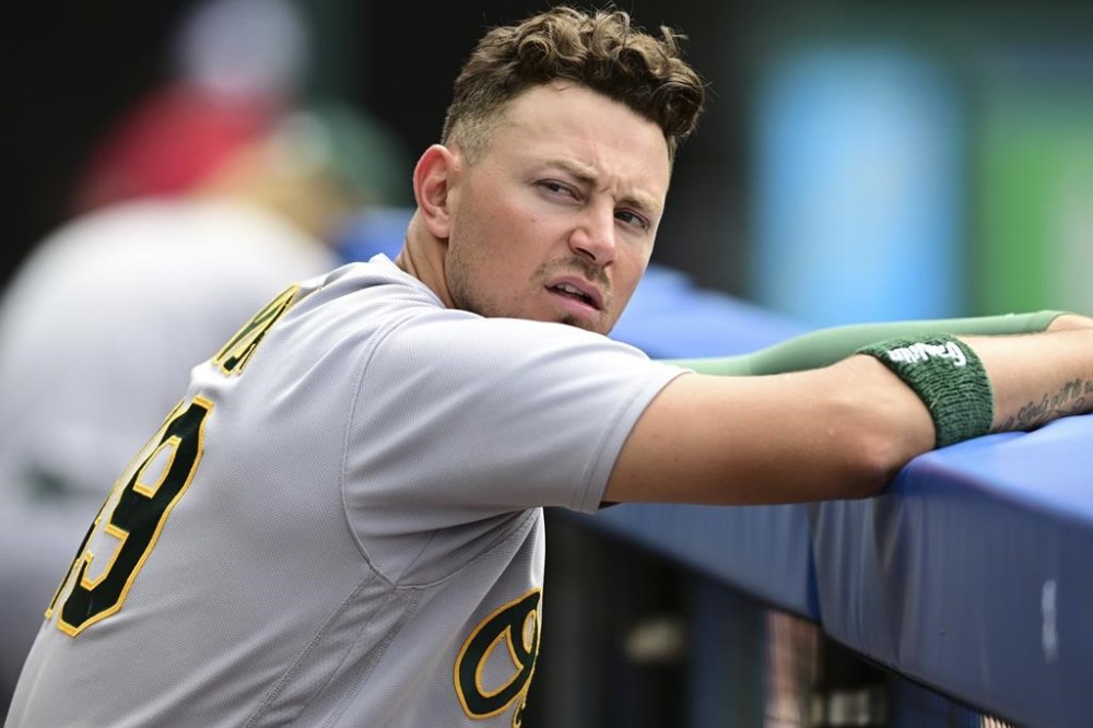 Oakland Athletics first baseman Ryan Noda sits in the dugout after the Athletics were defeated by the Cleveland Guardians 6-1 in a baseball game, Thursday, June 22, 2023, in Cleveland. (AP Photo/David Dermer)