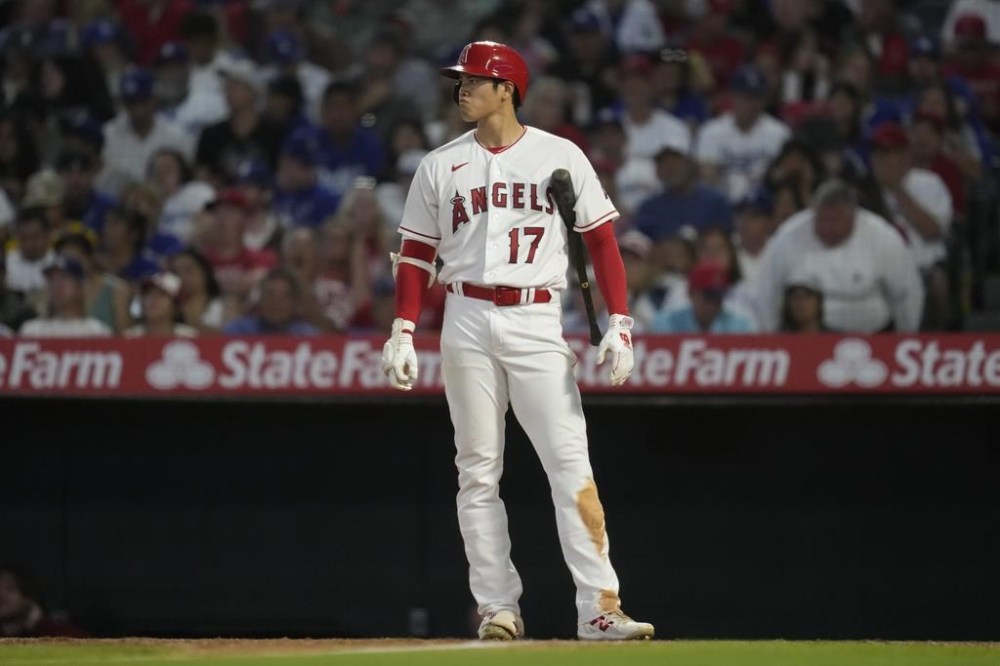 Los Angeles Angels' Shohei Ohtani (17) waits to bat during the sixth inning of a baseball game against the Los Angeles Dodgers in Anaheim, Calif., Wednesday, June 21, 2023. (AP Photo/Ashley Landis)