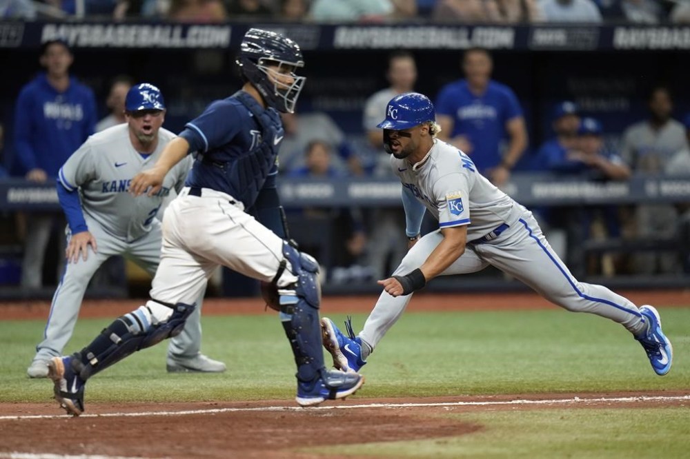 Kansas City Royals' MJ Melendez, right, scores past Tampa Bay Rays catcher Francisco Mejia on a two-run single by Drew Waters during the eighth inning of a baseball game Thursday, June 22, 2023, in St. Petersburg, Fla. (AP Photo/Chris O'Meara)