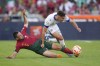 Portugal's Raphael Guerreiro, left, challenges for the ball with Bosnia's Amar Dedic during the Euro 2024 group J qualifying soccer match between Portugal and Bosnia and Herzegovina, at the Luz Stadium in Lisbon, Portugal, Saturday, June 17, 2023. (AP Photo/Armando Franca)