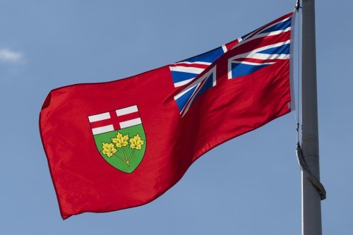 Ontario's provincial flag flies in Ottawa, Monday, July 6, 2020. The province&nbsp;is aiming to ban so-called floating accommodations from provincial waterways with new regulations set to take effect July 1.&nbsp;THE CANADIAN PRESS/Adrian Wyld