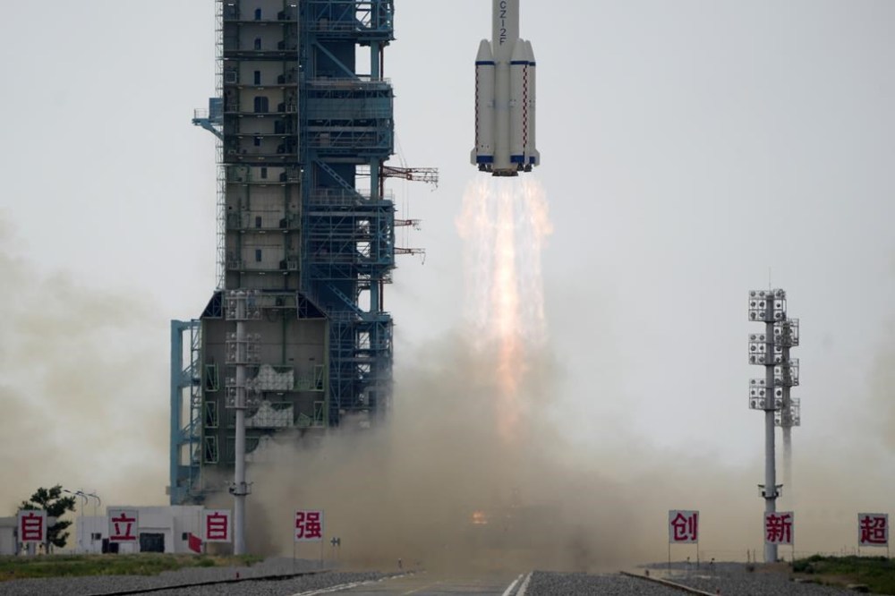 FILE - A Long March rocket carrying a crew of Chinese astronauts in a Shenzhou-16 spaceship lifts off at the Jiuquan Satellite Launch Center in northwestern China, Tuesday, May 30, 2023. On Friday, June 23, The Associated Press reported on videos circulating online incorrectly claiming a stagnant glass of water seen in clips of Chinese astronauts proves the footage wasn’t actually filmed in space. (AP Photo/Mark Schiefelbein, File)