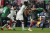Yunus Musah of the United States pushes Cesar Montes of Mexico during the second half of a CONCACAF Nations League semifinals soccer match Thursday, June 15, 2023, in Las Vegas. (AP Photo/John Locher)