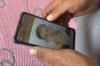 Saleh: Mohammed Saleh, the father of 18-year-old Yahia Saleh, holds a phone with a photo of his son at home in Ibrash, Egypt, Sunday, June 18, 2023. Yahia is one of dozens from the village feared to have drowned after a packed fishing vessel sank off Greece on June 14. There were as many as 750 migrants, including women and children, on board the trawler, which capsized and sank off Greece in one of the deepest parts of the Mediterranean Sea instead of docking in Italy. (AP Photo)