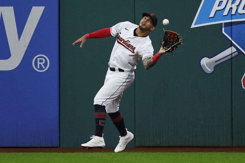 Cleveland Guardians right fielder Gabriel Arias catches a ball hit by Milwaukee Brewers' Luis Urias during the eighth inning of a baseball game, Friday, June 23, 2023, in Cleveland. (AP Photo/Ron Schwane)
