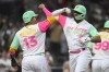 San Diego Padres' Xander Bogaerts (2), front right, is congratulated by Manny Machado (13) after hitting a three-run home run during the fifth inning of a baseball game against the Washington Nationals, Friday, June 23, 2023, in San Diego. (AP Photo/Denis Poroy)