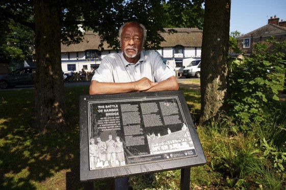 Clinton Smith, chair of Preston Black History Group is seen by the Ye Olde Hob Inn in Bamber Bridge near Preston, England. (Jon Super / The Associated Press files)