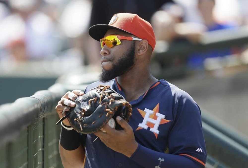 FILE - This March 15, 2015 file photo shows Houston Astros first baseman Jon Singleton in the dugout before the first inning of a spring training exhibition baseball game against the Washington Nationals in Kissimmee, Fla. The Astros signed Singleton to a minor league contract and assigned him to Triple A Sugar Land, the team announced Saturday, June 24, 2023. (AP Photo/Carlos Osorio, file)