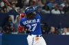 Toronto Blue Jays first baseman Vladimir Guerrero Jr. (27) hits a two-run home run, scoring teammate Brandon Belt, not shown, against the Oakland Athletics in sixth inning American League baseball action in Toronto, Saturday, June 24, 2023. THE CANADIAN PRESS/Jon Blacker