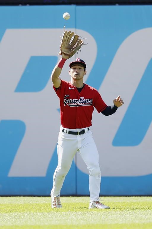 Cleveland Guardians left fielder Steven Kwan catches a ball hit by Milwaukee Brewers' Rowdy Tellez during the third inning of a baseball game, Saturday, June 24, 2023, in Cleveland. (AP Photo/Ron Schwane)
