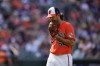 Baltimore Orioles starting pitcher Dean Kremer reacts after pitching to the Seattle Mariners in the third inning of a baseball game, Saturday, June 24, 2023, in Baltimore. (AP Photo/Julio Cortez)