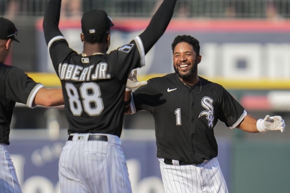 Chicago White Sox's Luis Robert Jr. (88) runs to Elvis Andrus as they celebrate after Andrus' walkoff single in a baseball game against the Boston Red Sox, Saturday, June 24, 2023, in Chicago. (AP Photo/Erin Hooley)