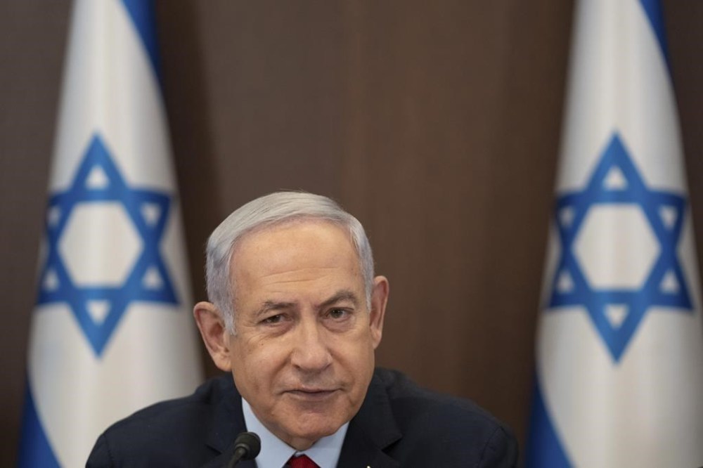 FILE - Israeli Prime Minister Benjamin Netanyahu chairs a cabinet meeting at the prime minister's office in Jerusalem, Sunday, June 18, 2023. Hollywood producer Arnon Milchan will testify on Sunday, June 25, at Israeli Prime Minister Netanyahu’s corruption trial to answer questions about an alleged “supply line” of lavish gifts funneled to the Israeli leader and his wife said to have been in exchange for help with Milchan’s personal and business needs. (AP Photo/Ohad Zwigenberg, File)