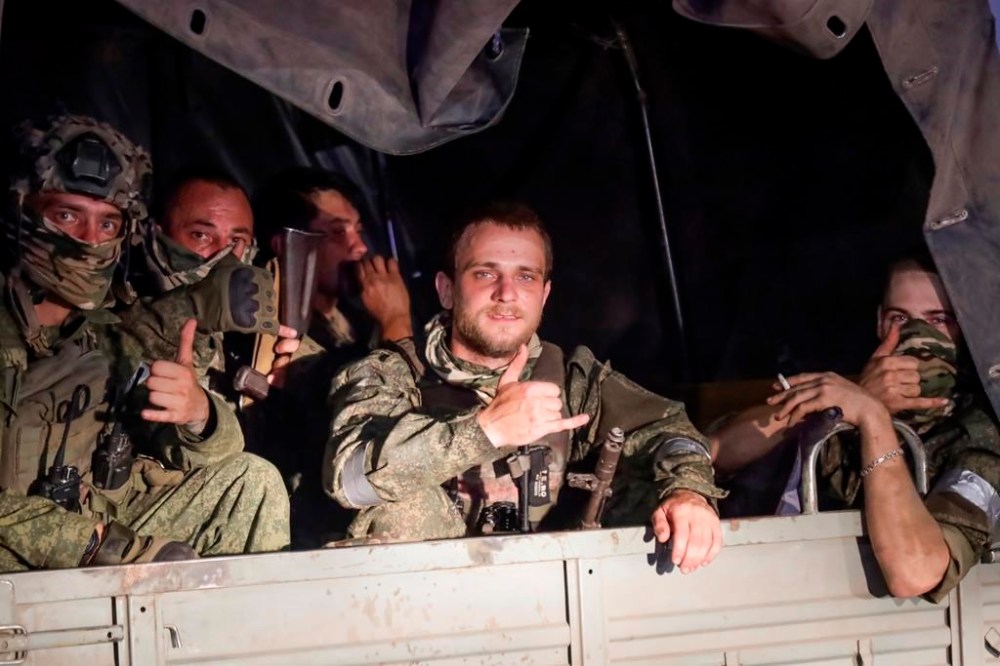 Members of the Wagner Group military company sit in their vehicle on a street in Rostov-on-Don, Russia, Saturday, June 24, 2023, as they prepare to leave an area at the headquarters of the Southern Military District. Yevgeny Prigozhin's troops who joined him in the uprising will not face prosecution and those who did not will be offered contracts by the Defense Ministry. After the deal was reached Saturday, Prigozhin ordered his troops to halt their march on Moscow and retreat to field camps in Ukraine, where they have been fighting alongside Russian troops. (AP Photo)