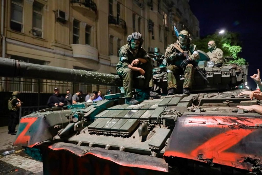 FILE - Membes of the Wagner Group military company sit atop of a tank on a street in Rostov-on-Don, Russia, Saturday, June 24, 2023, prior to leaving an area at the headquarters of the Southern Military District. (AP Photo, File)