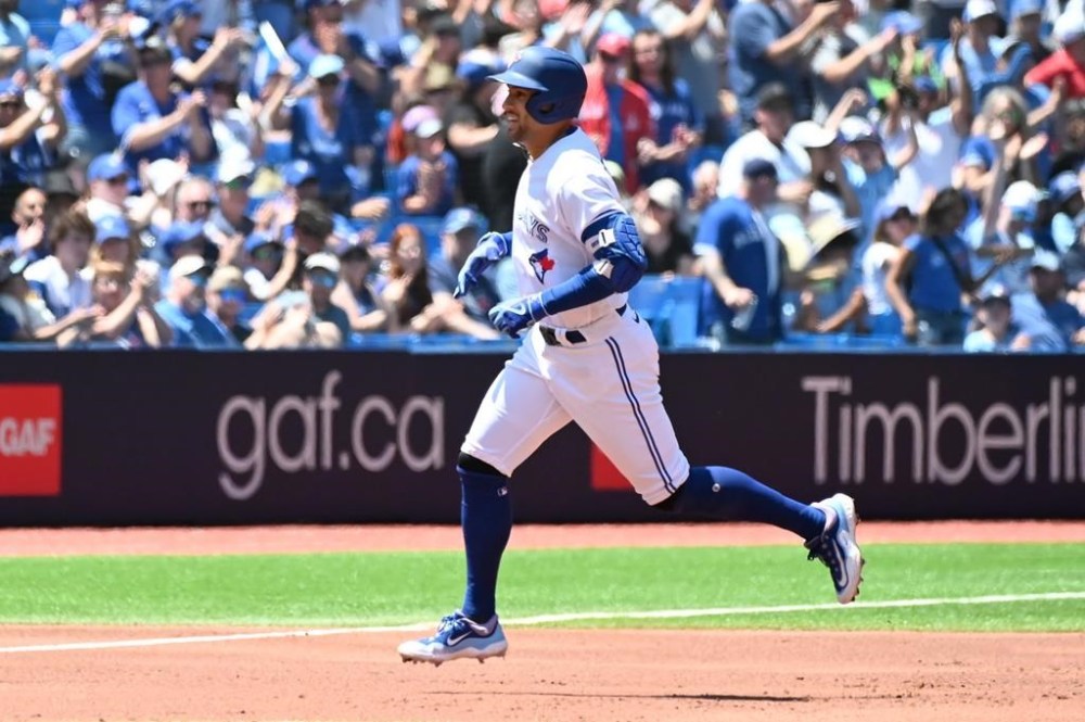 Toronto Blue Jays centre fielder George Springer (4) rounds the bases after hitting a solo home run against the Oakland Athletics in first inning American League baseball action in Toronto on Sunday, June 25, 2023. THE CANADIAN PRESS/Jon Blacker