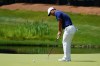 Tom Kim, of South Korea, putts on the eighth green during the final round of the Travelers Championship golf tournament at TPC River Highlands, Sunday, June 25, 2023, in Cromwell. (AP Photo/Frank Franklin II)