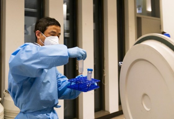 Research scientist Yi Yang retrieves samples at UW Medicine's Cancer Vaccine Institute  on May 25, in Seattle. (Lindsey Wasson / The Associated Press files)