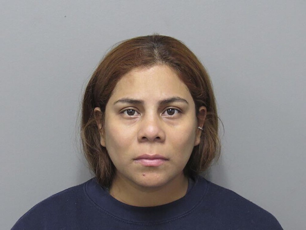 In this booking photo provided by the Cuyahoga County Sheriff's Department, is Kristel Candelario, 31, of Cleveland, Ohio. Prosecutors in Ohio have announced murder charges against a woman in the death of her 16-month-old daughter, who authorities allege was left alone for 10 days while she went on vacation. (Cuyahoga County Sheriff's Department via AP)