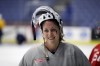 FILE - United States forward Meghan Duggan smiles after hockey practice in Plymouth Township, Mich., Dec. 15, 2016. The NHL and NHLPA are launching a new inclusion committee made up of current and former men’s and women’s players, with minority and LGBTQ+ representation, aimed at diversifying hockey and making the sport more welcoming. The 20-member coalition is chaired by former NHL players P.K. Subban and Anson Carter, each of whom is Black, and includes retired U.S. women’s star Meghan Duggan, who is openly gay.. (AP Photo/Carlos Osorio, File)