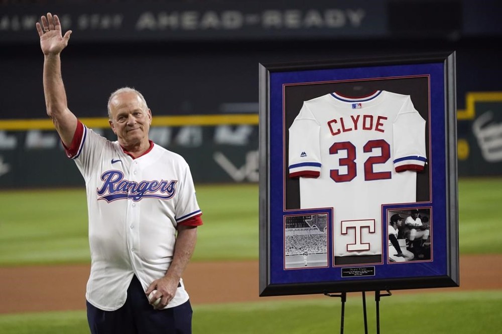 Former Major League pitcher David Clyde waves after he was honored before a baseball game between the Detroit Tigers and Texas Rangers in Arlington, Texas, Tuesday, June 27, 2023. (AP Photo/LM Otero)