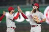 Philadelphia Phillies shortstop Trea Turner, left, and center fielder Brandon Marsh celebrate the team's 5-1 win over the Chicago Cubs in a baseball game Tuesday, June 27, 2023, in Chicago. (AP Photo/Charles Rex Arbogast)