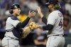 Cleveland Guardians relief pitcher Emmanuel Clase (48) and catcher Bo Naylor celebrate after their baseball game against the Kansas City Royals Tuesday, June 27, 2023, in Kansas City, Mo. The Guardians won 2-1. (AP Photo/Charlie Riedel)