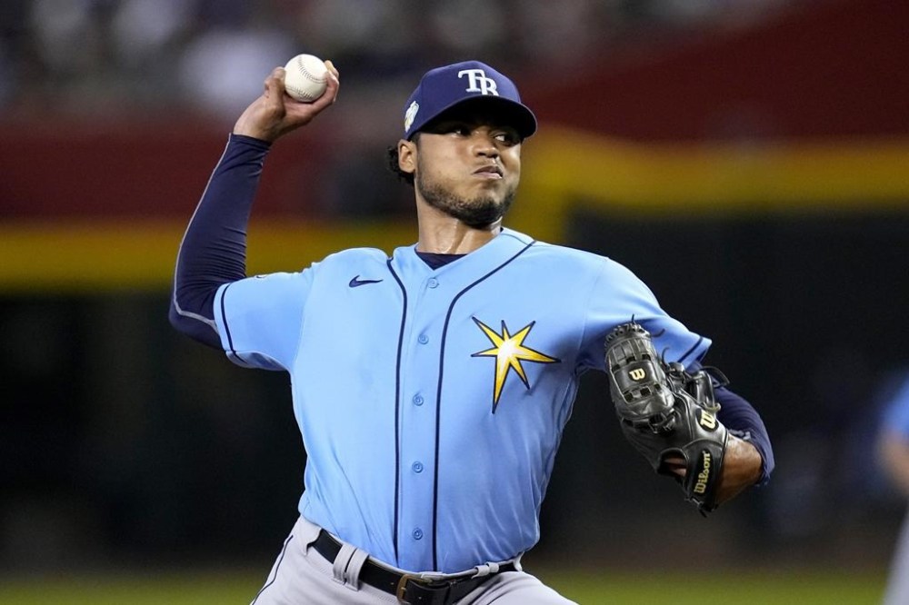 Tampa Bay Rays starting pitcher Taj Bradley throws against the Arizona Diamondbacks during the first inning of a baseball game Tuesday, June 27, 2023, in Phoenix. (AP Photo/Ross D. Franklin)