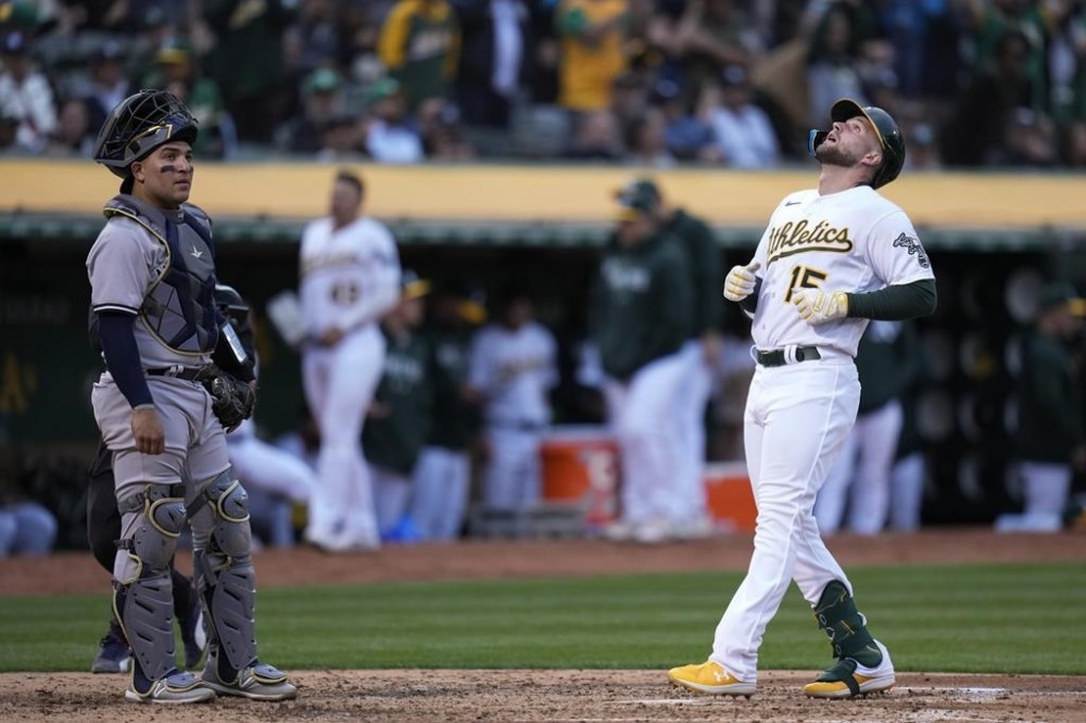 Oakland Athletics' Seth Brown looks skywards as he scores on a solo home run against the New York Yankees during the fourth inning of a baseball game in Oakland, Calif., Tuesday, June 27, 2023. (AP Photo/Godofredo A. Vásquez)