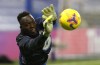 FILE - Chelsea goalkeeper Edouard Mendy warming up before the English Premier League soccer match between Chelsea and Newcastle United at Stamford Bridge Stadium in London, England, Monday, Feb. 15, 2021. Goalkeeper Edouard Mendy has joined Saudi Arabian team Al-Ahli. He becomes the latest Chelsea player to head to the oil-rich kingdom. (Adrian Dennis/Pool via AP, File)