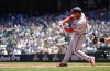 Washington Nationals' Keibert Ruiz hits a two-run single against Seattle Mariners starting pitcher Logan Gilbert during the first inning of a baseball game Wednesday, June 28, 2023, in Seattle. (AP Photo/Lindsey Wasson)