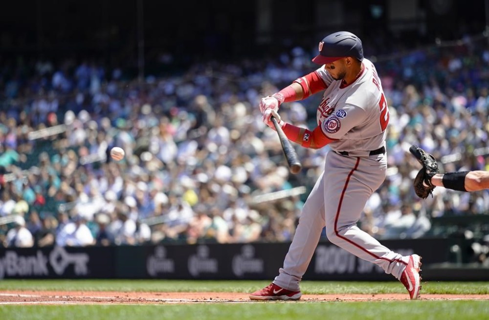 Washington Nationals' Keibert Ruiz hits a two-run single against Seattle Mariners starting pitcher Logan Gilbert during the first inning of a baseball game Wednesday, June 28, 2023, in Seattle. (AP Photo/Lindsey Wasson)