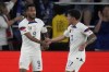 United States' Jesus Ferreira (9) is congratulated by teammate Alejandro Zendejas (17) after scoring during the first half of a CONCACAF Gold Cup soccer match against St. Kitts & Nevis Wednesday, June 28, 2023, in St. Louis. (AP Photo/Jeff Roberson)