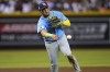 Tampa Bay Rays' Isaac Paredes throws out Arizona Diamondbacks' Nick Ahmed during the fourth inning of a baseball game, Wednesday, June 28, 2023, in Phoenix. (AP Photo/Matt York)