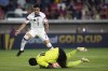 United States' Alan Sonora (7) leaps over St. Kitts & Nevis' goalkeeper Julani Archibald (18) during the second half of a CONCACAF Gold Cup soccer match Wednesday, June 28, 2023, in St. Louis. (AP Photo/Jeff Roberson)