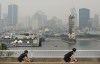 The skyline of Montreal is obscured by a haze of smoke from forest fires on Sunday, June 25, 2023. A Montreal amusement park says it is cancelling the first night of an international fireworks festival due to concerns over air quality stemming from forest fires in northern Quebec. THE CANADIAN PRESS/Graham Hughes