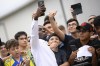 US soccer player Timothy Weah, front, takes a selfie as he arrives for fitness tests at the Italian soccer club Juventus F.C. in Turin, Italy, Thursday, June 29, 2023. (Fabio Ferrari/LaPresse via AP)