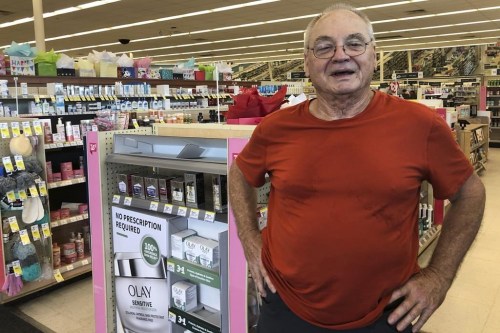 John Manger, 74, talks about dealing with scorching heat in the Memphis suburb of Bartlett, Tenn., on Thursday, June 29, 2023. He and his wife lost power during strong storms on Sunday and were waiting for it to be restored. (AP Photo/ Adrian Sainz)
