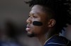 Atlanta Braves' Ronald Acuna Jr. sits in the dugout during the third inning of a baseball game against the Cincinnati Reds, Sunday, June 25, 2023, in Cincinnati. (AP Photo/Jeff Dean)