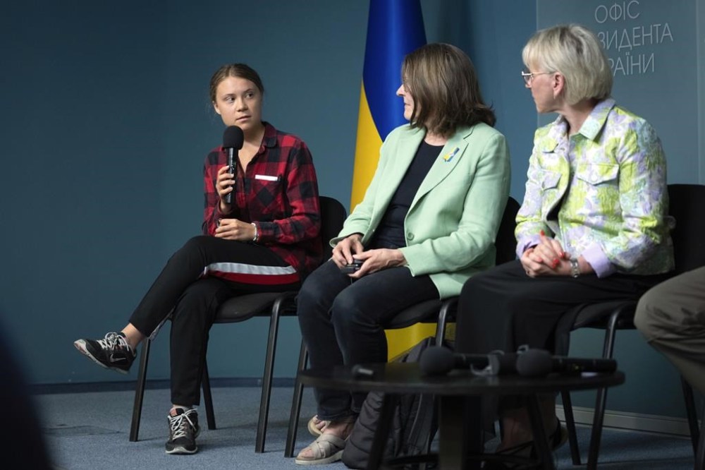 Eco-activist Greta Thunberg, left, Vice-President of the European Parliament Heidi Hautala, center, and ex-Deputy Prime Minister and ex-Minister of Foreign Affairs of Sweden Margot Wallstrom hold a press-conference of a newly created working group that will work with the damages caused to Ukraine's ecology as a result of Russia's invasion in Kyiv, Ukraine, Thursday, June 29, 2023. (AP Photo/Efrem Lukatsky)