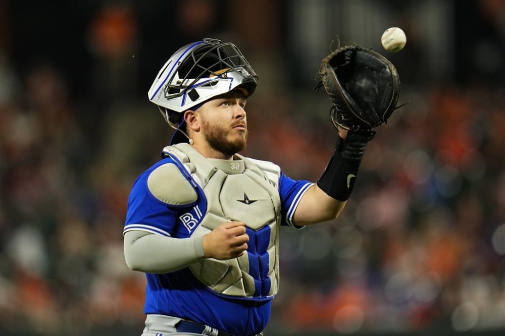 Toronto Blue Jays catcher Alejandro Kirk gets a new ball after a play during the eighth inning of a baseball game between the Baltimore Orioles and the Toronto Blue Jays, Wednesday, June 14, 2023, in Baltimore. Kirk has returned from the Toronto Blue Jays 10-day injured list. THE CANADIAN PRESS/AP-Julio Cortez